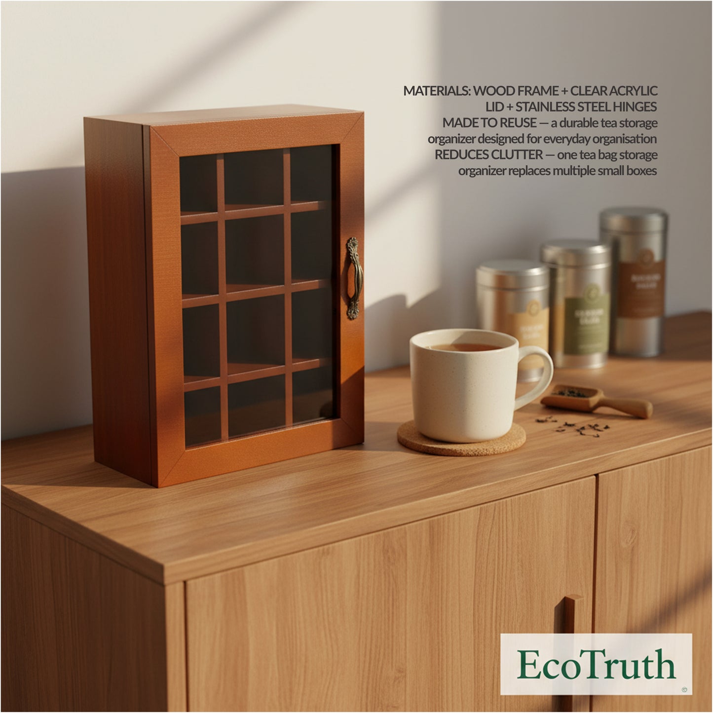 EcoTruth panel image: Wooden tea bag storage box with clear acrylic window and metal handle on a countertop beside a mug and tea tins (EcoTruth materials callout).