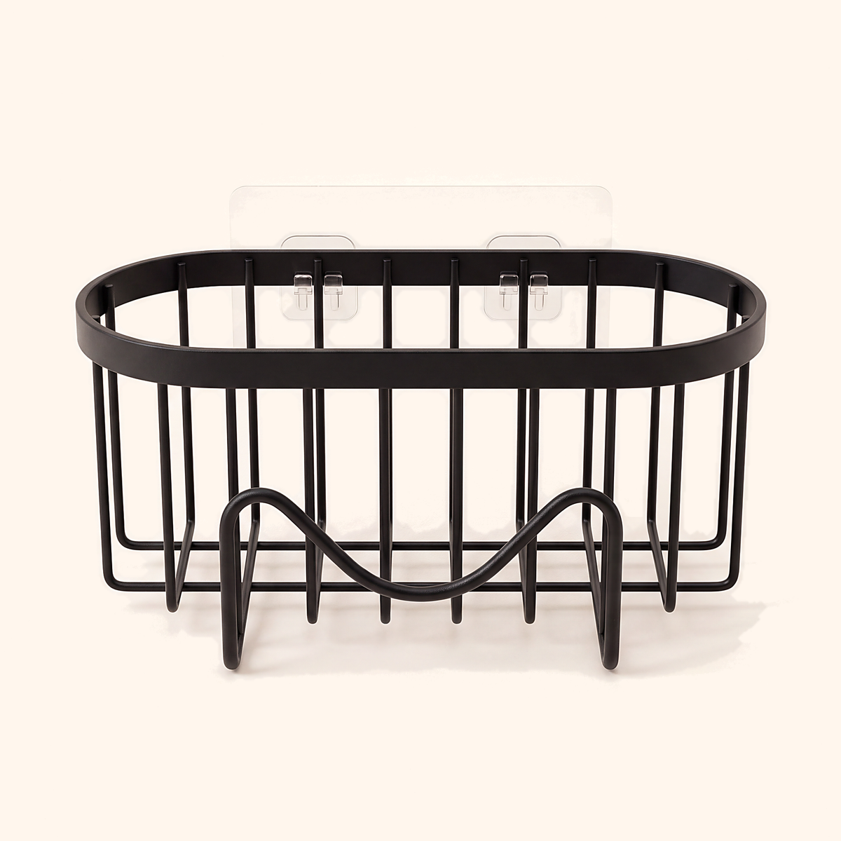 Black suction cup sponge holder with a wave-shaped front rack, on cream