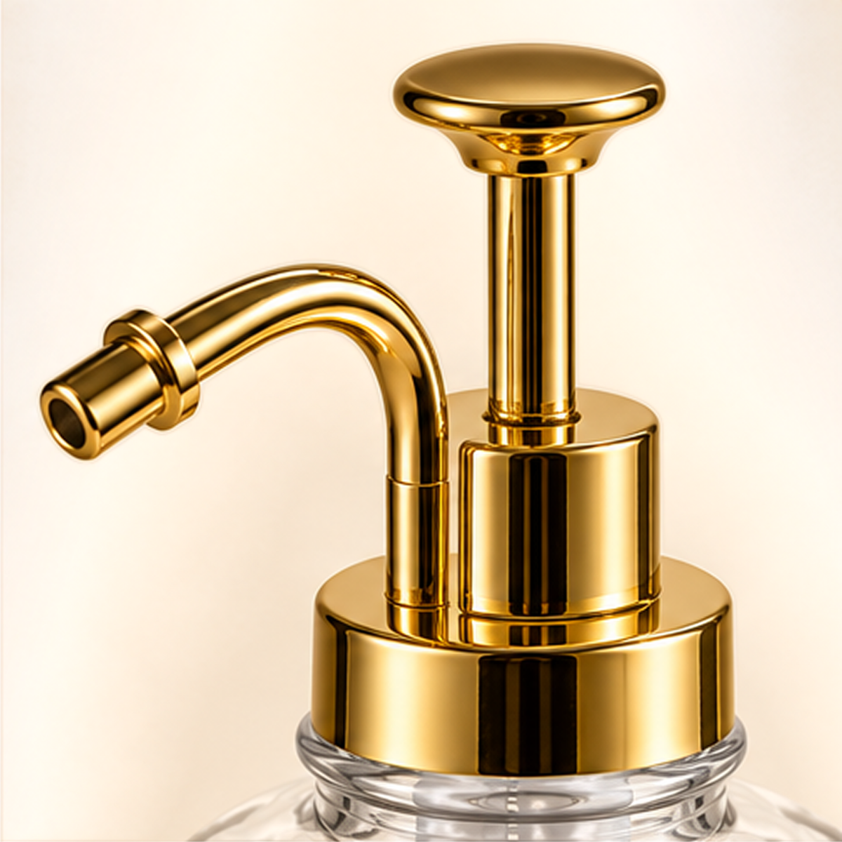 Close-up of the gold-tone pump head and curved spout on the glass bottle