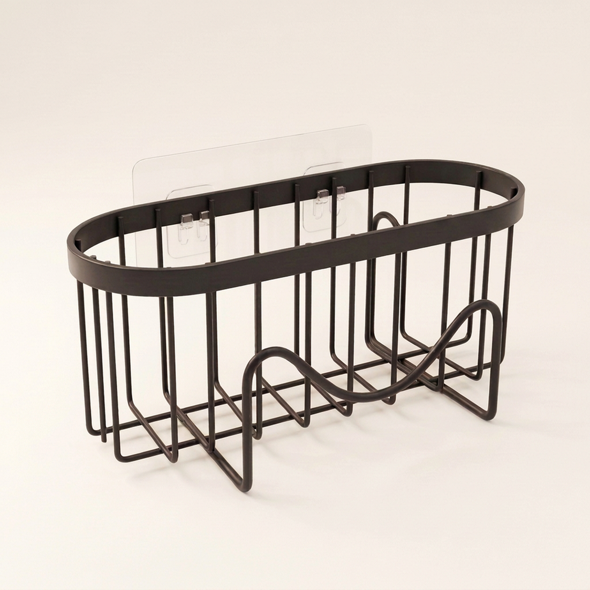 Black wire sponge basket on its clear adhesive plate