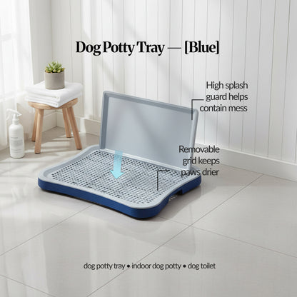 Blue indoor dog potty tray with splash guard and removable grid, shown in a tiled room with arrows and callouts highlighting the guard and grid.