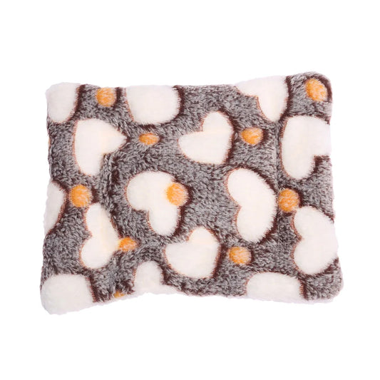 Guinea pig bed mat in plush coral fleece with cotton padding, shown on a clean white background – cosy cage comfort pad
