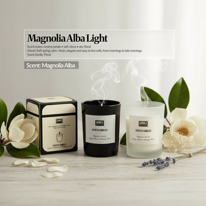 Magnolia Alba Light scent candle set — Black and frosted glass candles with matching box, magnolia flowers and greenery; “Magnolia Alba Light” scent notes overlay.