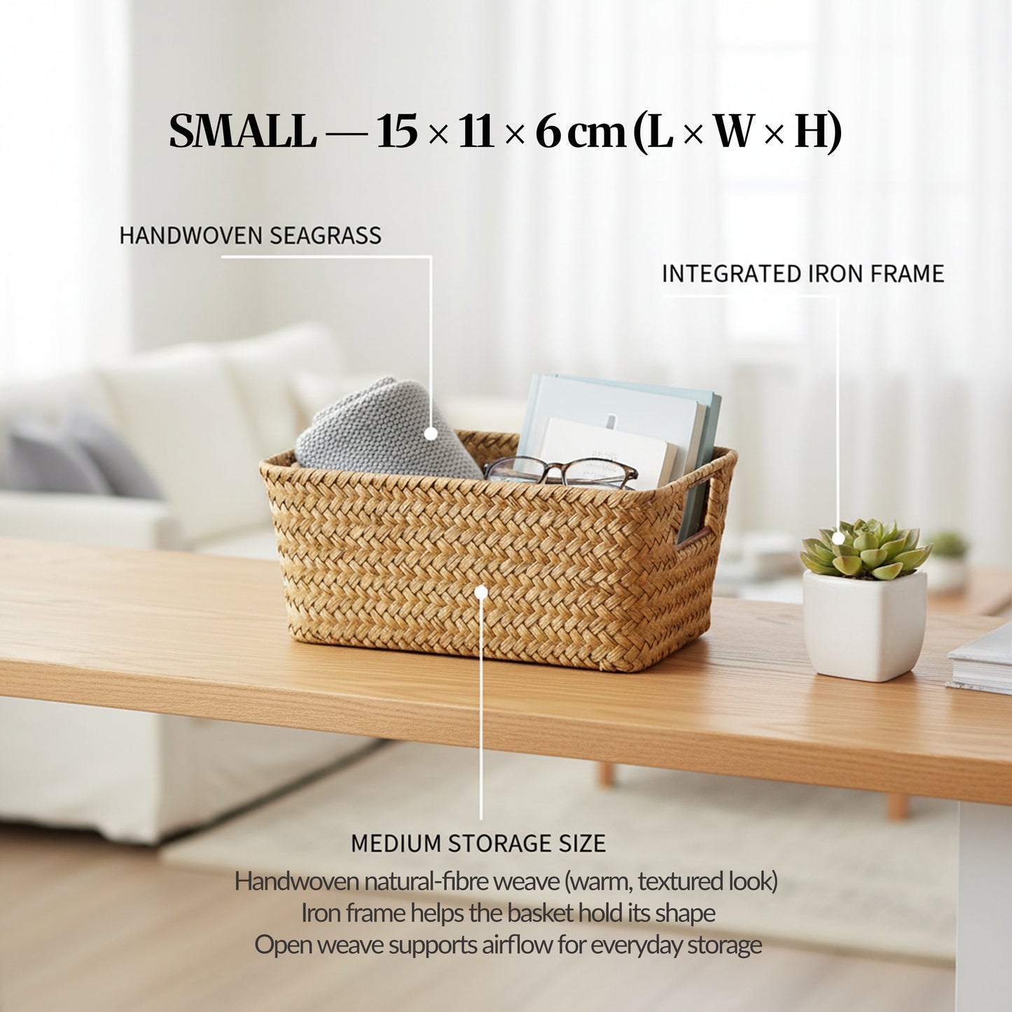 Image 04 (Variant Focus — Small): Small handwoven seagrass basket on a desk with labelled callouts for handwoven seagrass and integrated iron frame, showing size 15 × 11 × 6 cm.