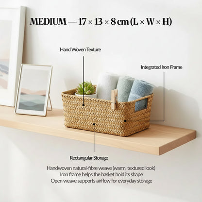 Medium handwoven seagrass basket on a shelf with labelled callouts for handwoven texture and integrated iron frame, showing size 17 × 13 × 8 cm.
