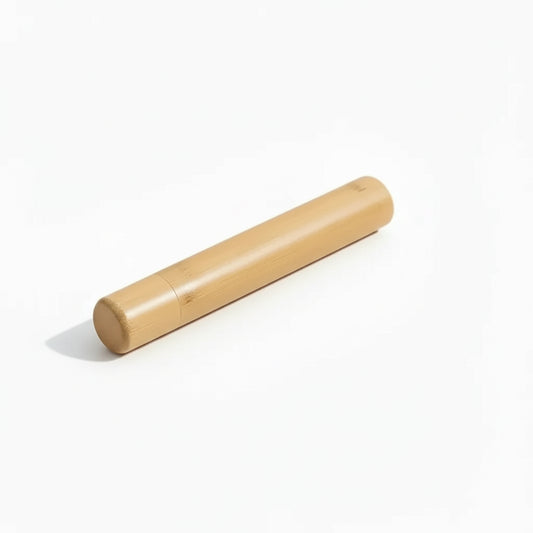 Portable bamboo toothbrush holder travel tube with matching cap and toothbrush on white background. 