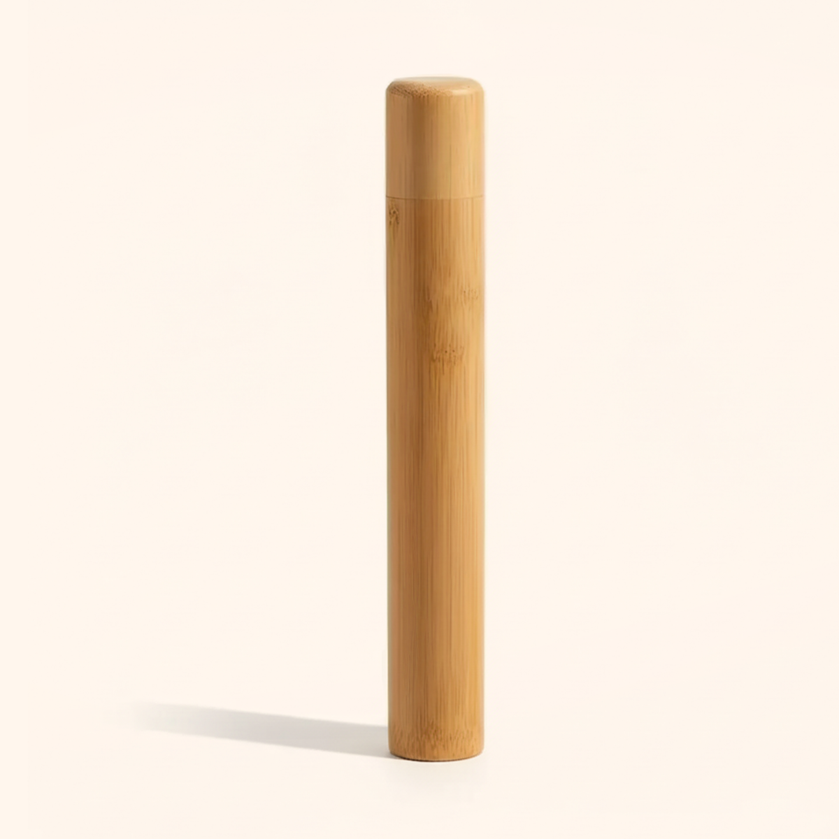 Bamboo toothbrush travel case, adult 21 cm, standing upright on a soft cream background
