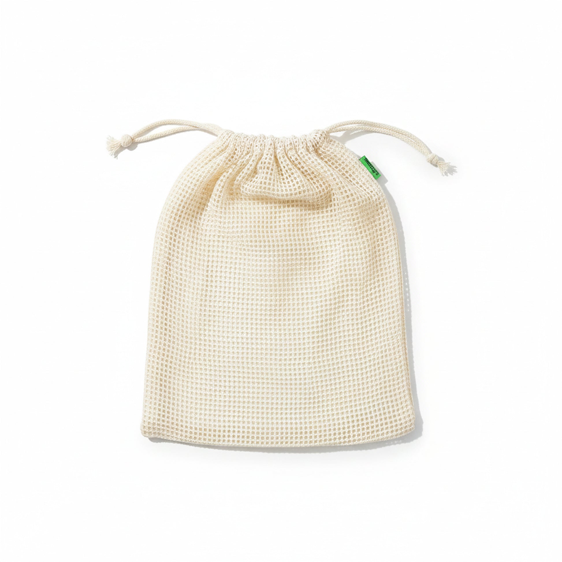 Single reusable cotton mesh produce bag on a white background, showing the medium-size drawstring bag shape and texture.