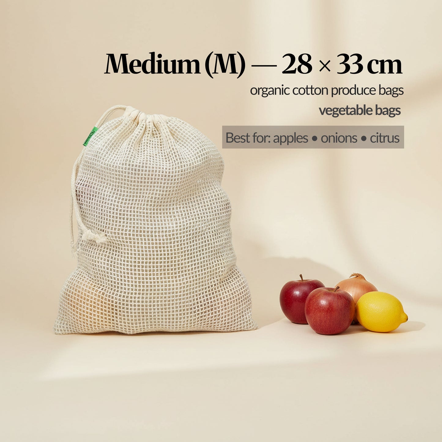 Medium (M) cotton mesh produce bag (28 × 33 cm) shown with fruit and veg, with sizing and “best for” use guidance on the image.