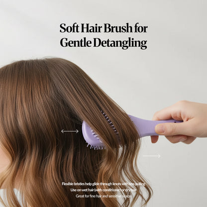 Detangling brush gliding through long hair, highlighting gentle brushing with flexible bristles.