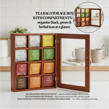 Open tea bag storage box with 12 compartments showing assorted tea sachets, clear acrylic door swung open on kitchen counter.