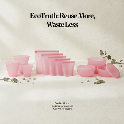EcoTruth: Reuse More, Waste Less — Pink silicone food storage set laid out on a neutral surface, showing reusable silicone bags, bowls with lids, and cups as a lower-waste alternative to single-use items.