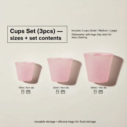 Cups set (3pcs) — sizes + contents — Three pink silicone cups shown in small, medium, and large sizes with capacity/diameter labels (100ml, 250ml, 500ml) and set-contents callout.
