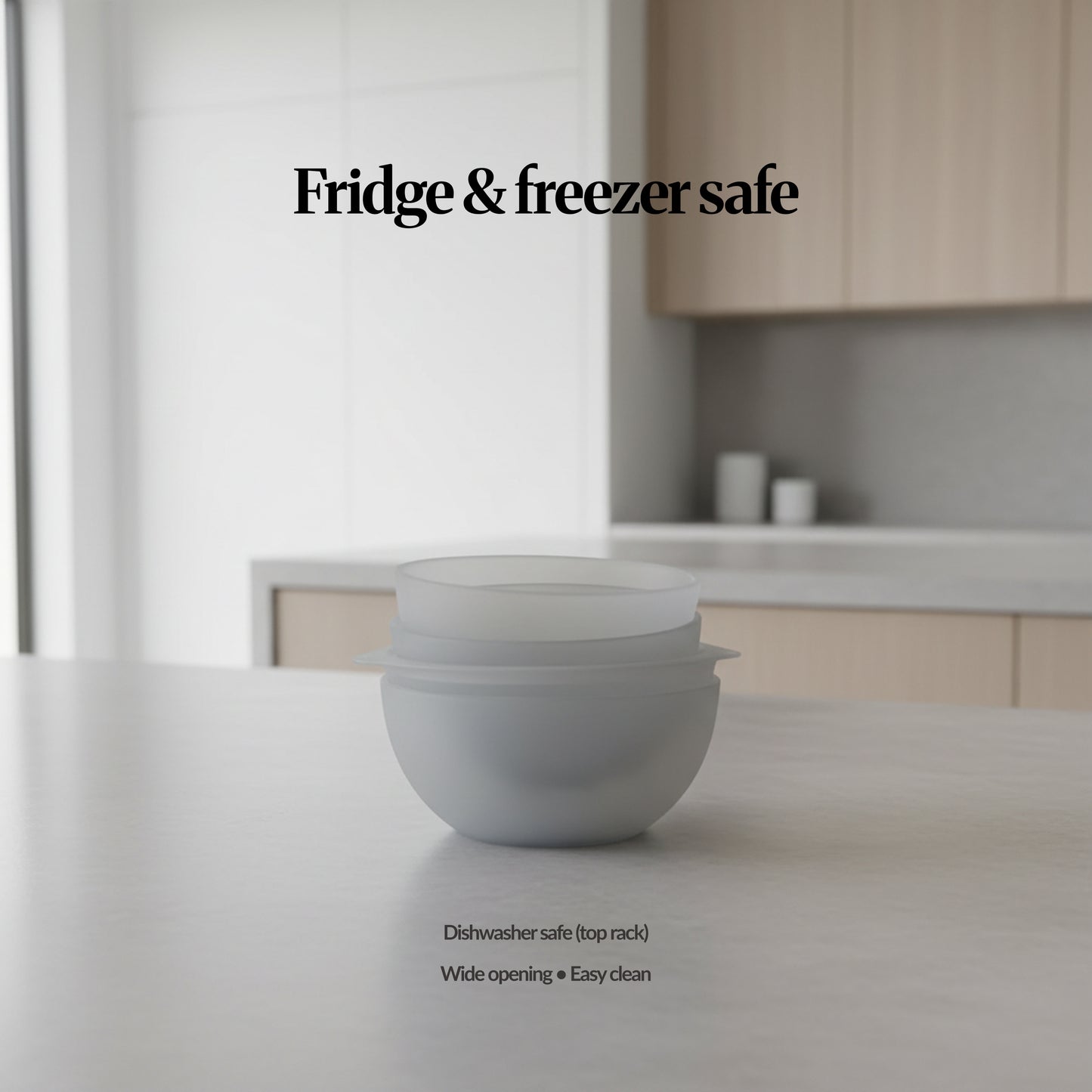 Fridge & freezer safe (bowls) — lifestyle — Frosted silicone bowls with lids shown stacked on a kitchen counter, highlighting fridge/freezer use and easy-clean design.