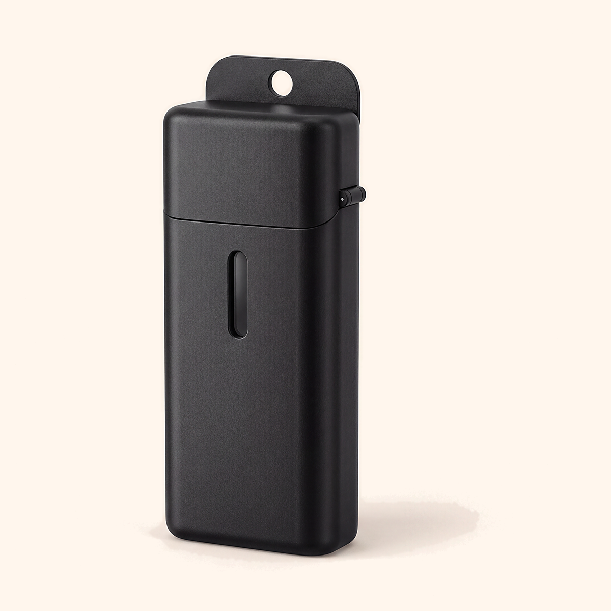 Closed black straw case with a hole at the top, standing on a soft cream background