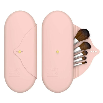 Pink silicone makeup brush holder travel cosmetic bag closed, shown on a clean white background. 