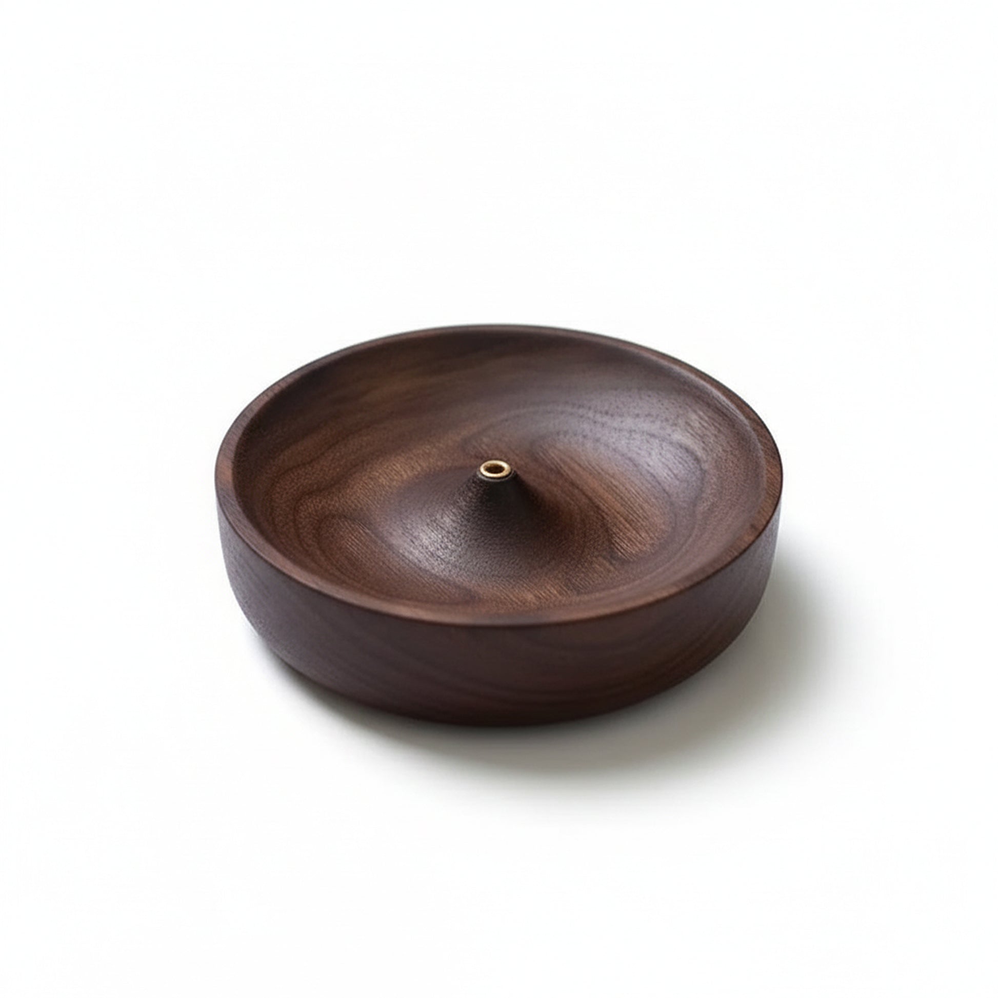 Product-only image of the dark wooden incense holder bowl with a central brass holder on a clean white background.