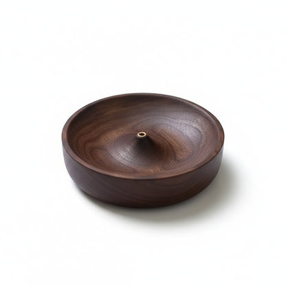 Product-only image of the dark wooden incense holder bowl with a central brass holder on a clean white background.