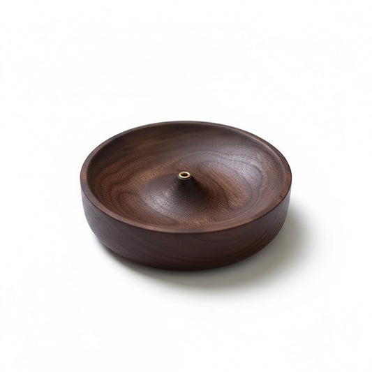Product-only image of the dark wooden incense holder bowl with a central brass holder on a clean white background.