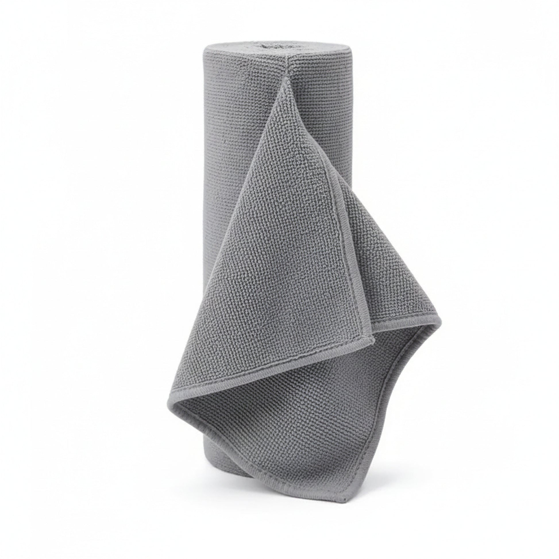 Grey Reusable microfiber paper towel roll standing upright on a plain white background 
