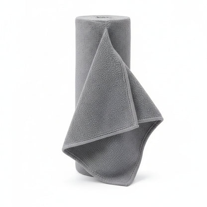 Grey Reusable microfiber paper towel roll standing upright on a plain white background 