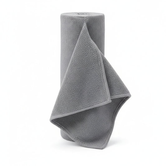 Grey Reusable microfiber paper towel roll standing upright on a plain white background 