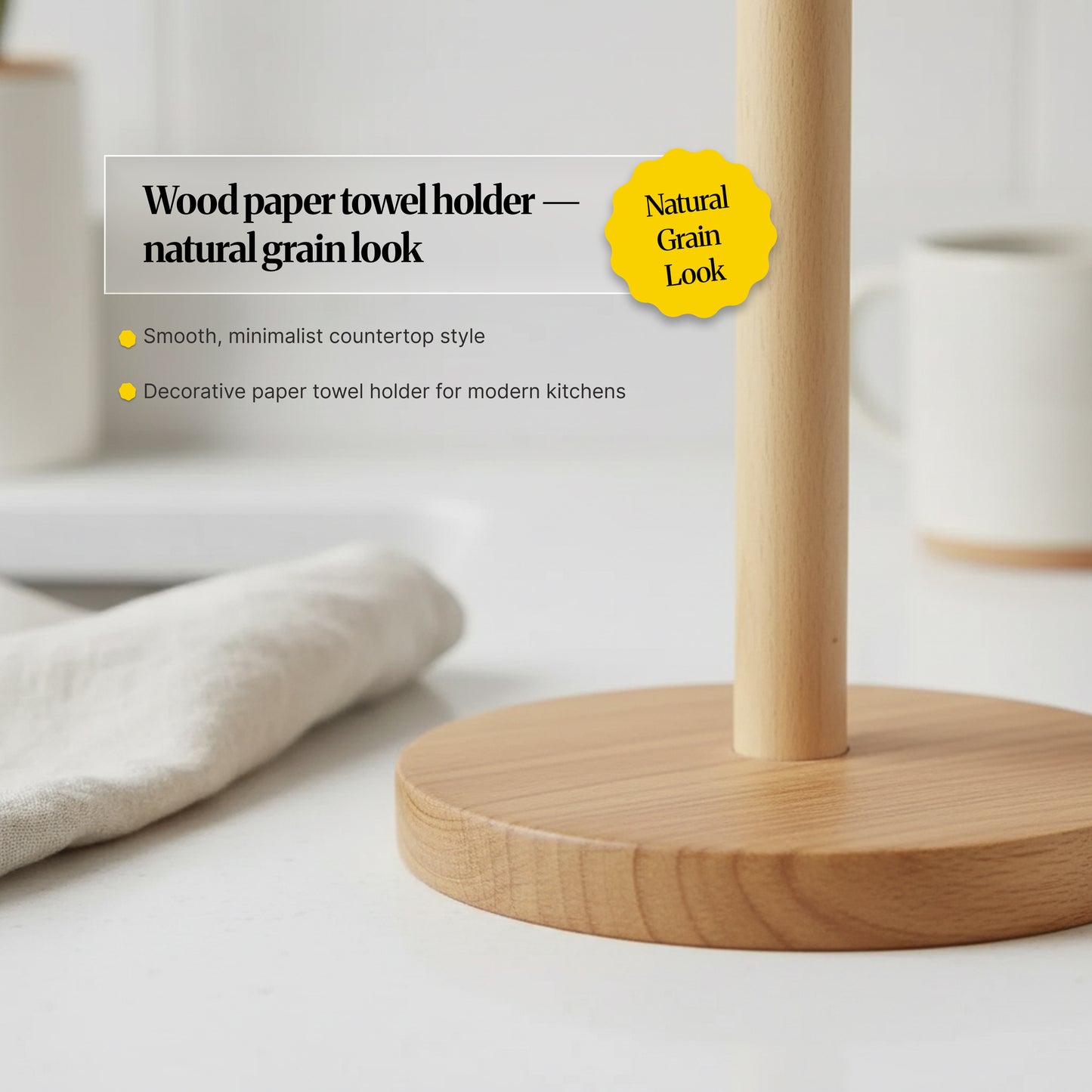 Close-up of the paper towel holder’s smooth wooden base and upright post, showing the natural grain look and minimalist countertop style.