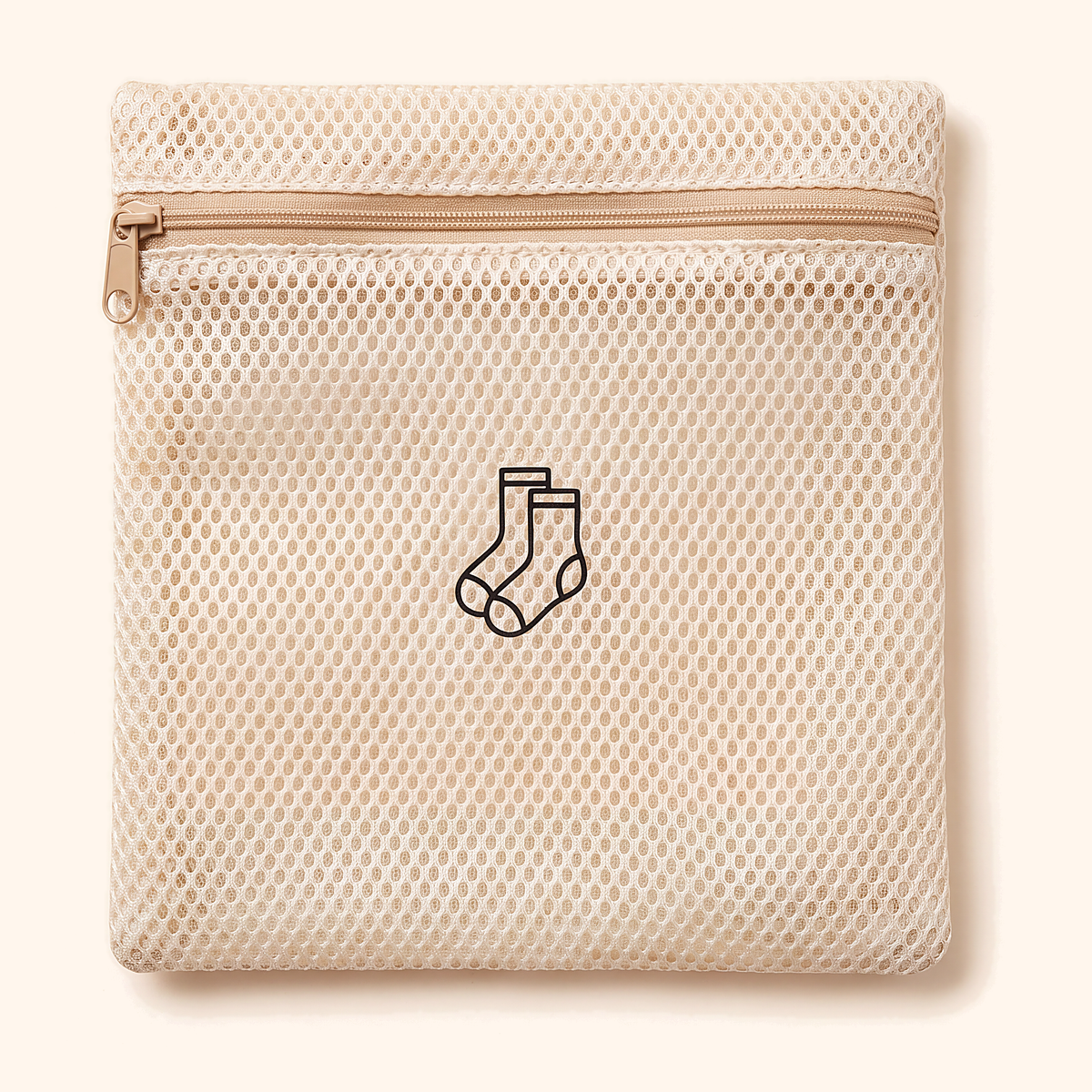 Small flat mesh bag with a tan zip and an embroidered pair of socks