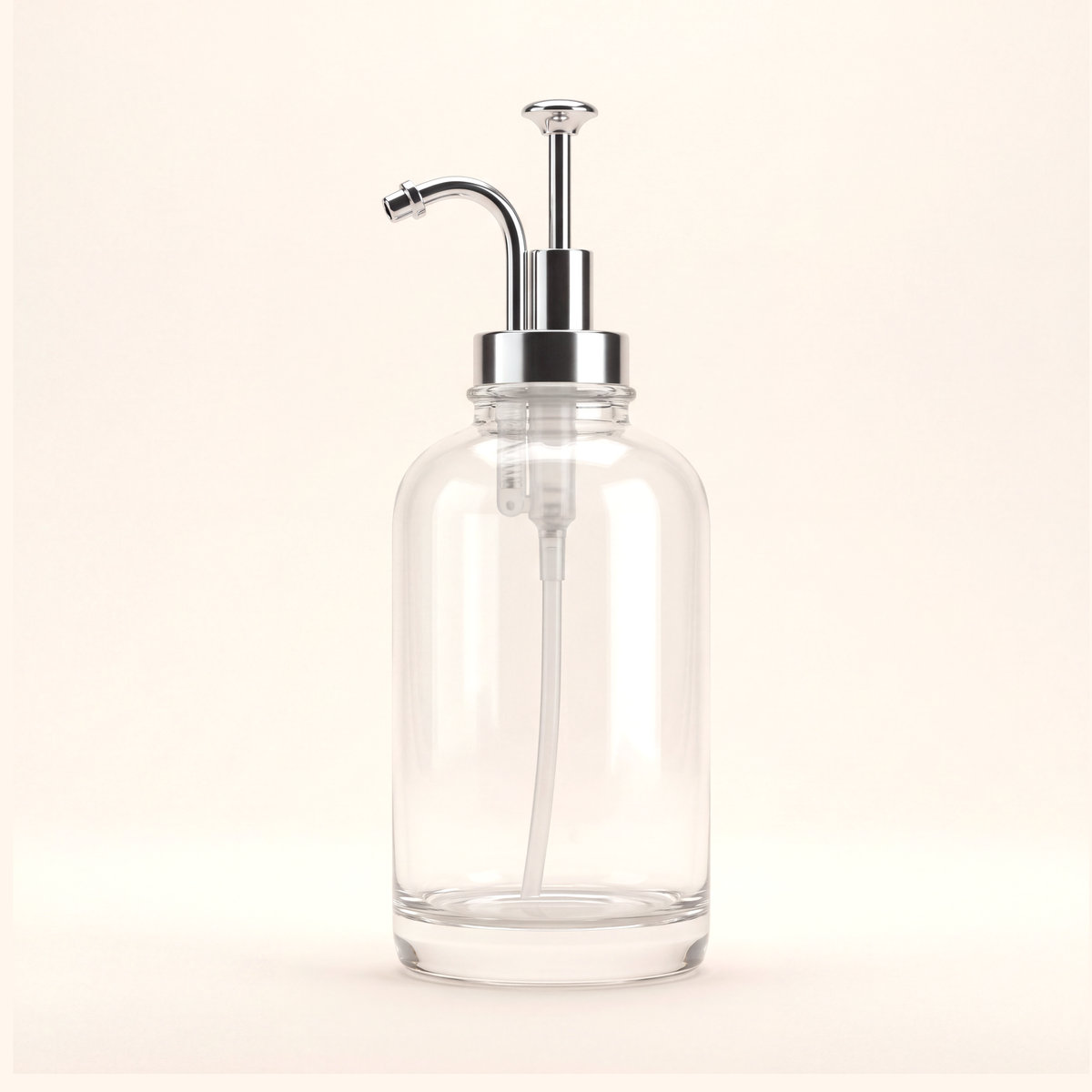 Clear glass bottle with a curved silver-tone pump and dip tube, on cream