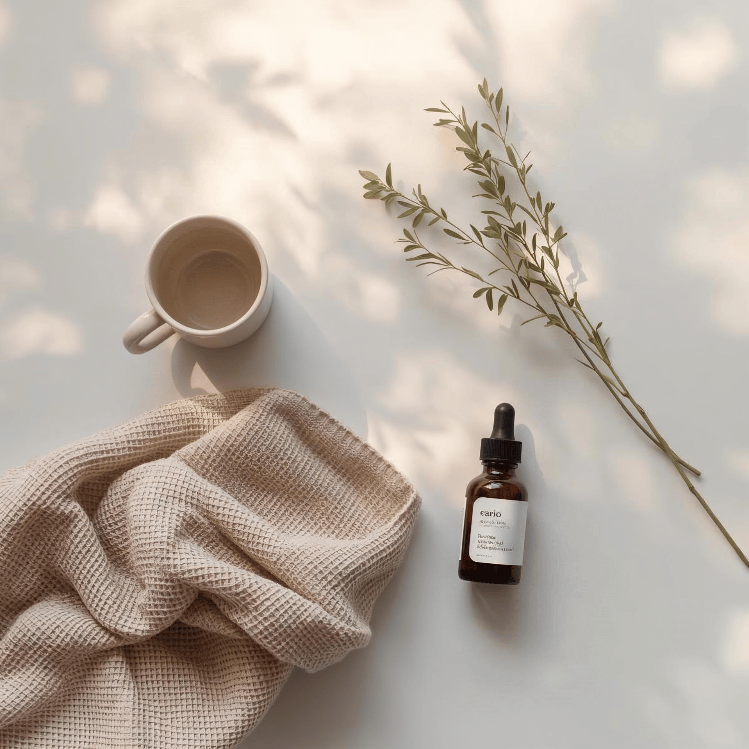 Calm morning ritual with stainless steel water bottle, amber soap dispenser and bar soap on a neutral beige table – gentle eco self-care essentials.